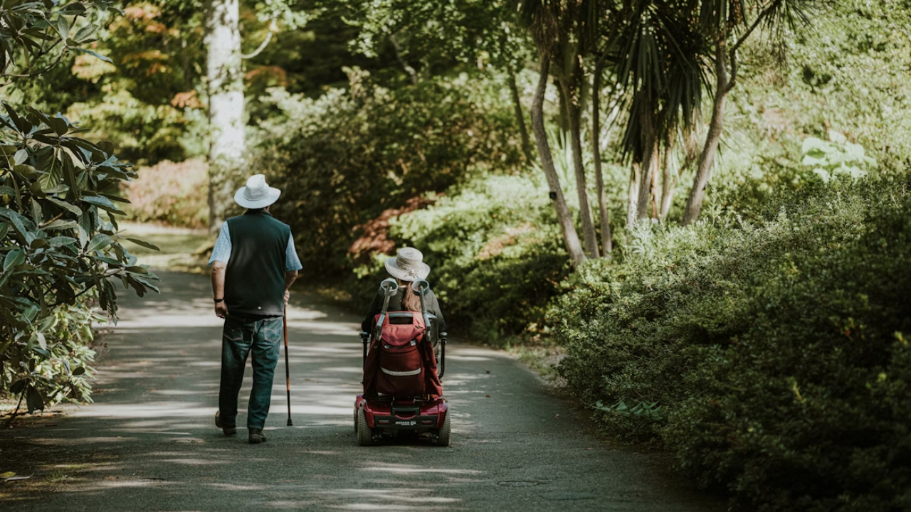 elderly-man-and-woman-walking-down-the-road