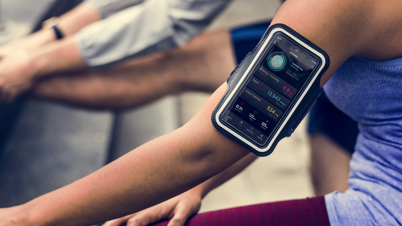 Sporty woman with a smart gadget