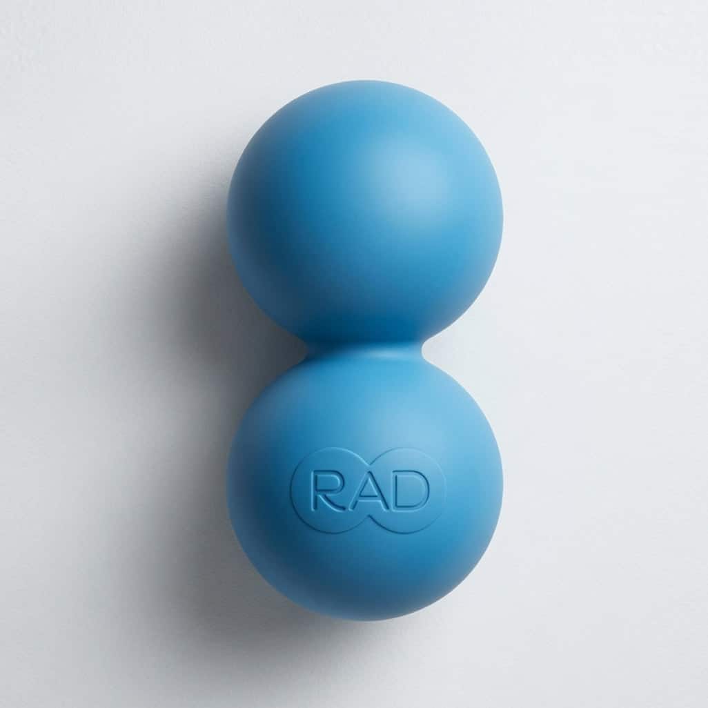 RAD Roller | Wellness + Wisdom RAD Roller peanut shaped massage tool used for spine safe self myofascial release on the upper back with Josh Trent Wellness and Wisdom
